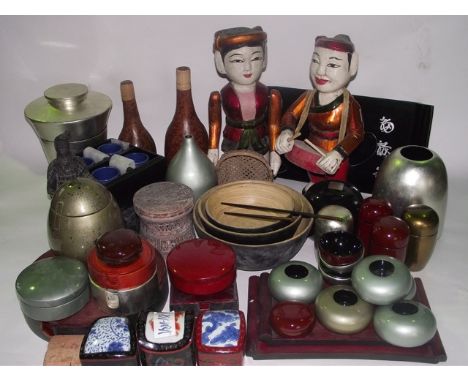 An extensive collection of contemporary decorative Eastern effects to include lacquer bowls, vessels, candle stands, photogra