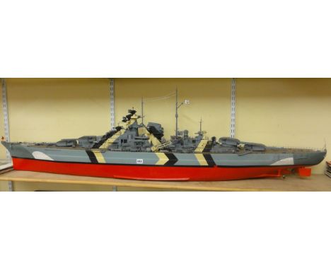 A large remote control scale model of the "Bismarck" approximately 6ft long, together with a bespoke packing/transportation c