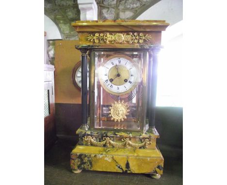A French Empire period four pane mantle clock set within Sienna marble and with further reeded column supports with 8 day str