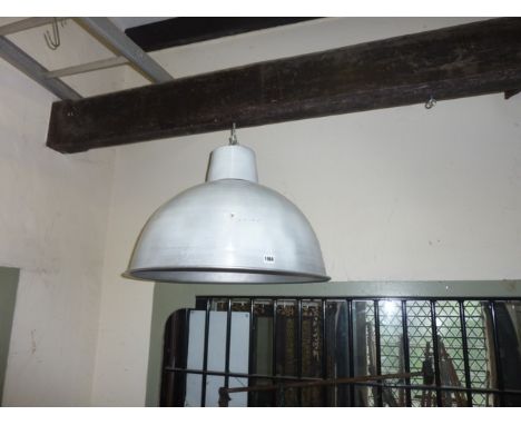 An industrial size aluminium hanging domed ceiling shade, together with a vintage industrial work light with green enamelled 
