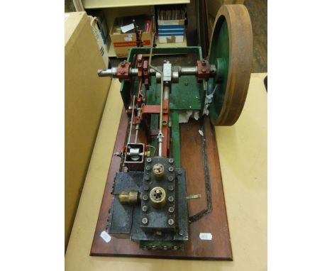 A scratch built scale model of a stationary engine, with single fly wheel, and two levers, etc, mounted on a later associated