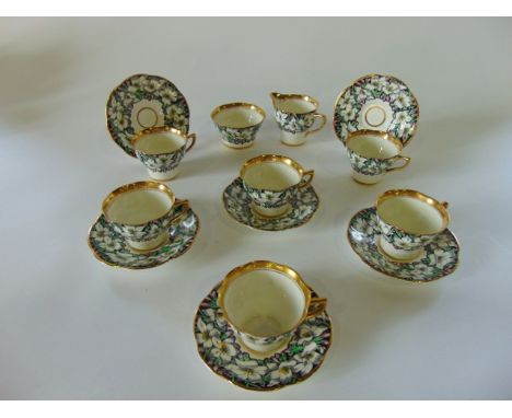 A collection of Rosine China teawares with printed infilled white lily and other floral decoration, pattern number 4860, comp