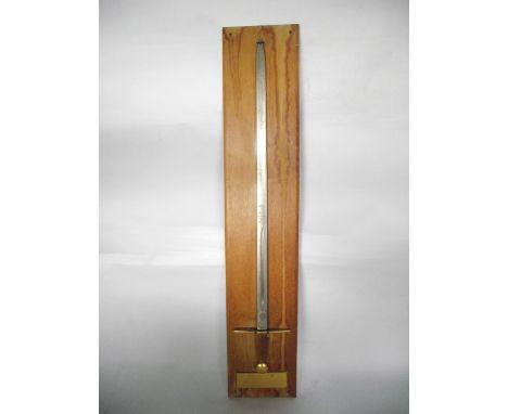 A wall hanging replica of "Knightly" war sword 1272-1307, commemorating the investiture of Prince Charles, 21st Prince of Wal