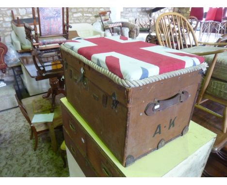 A vintage canvas and leather reinforced travelling trunk with brass fittings and initialled AK with later, but decorative, Un