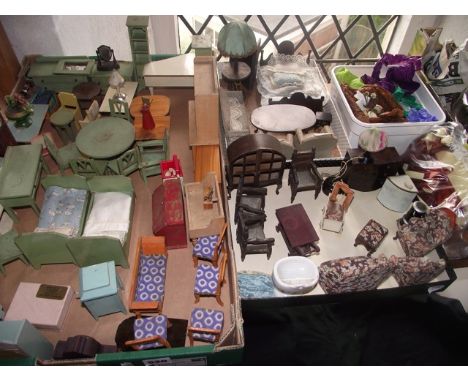A large collection of 20th century dolls house model furniture, many examples, highly detailed and painted, some upholstered,