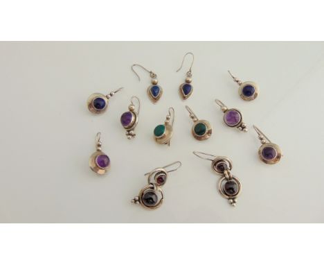 A pair of sterling silver lapis lazuli drop earrings; a pair of sterling silver and amethyst earrings; and four further pairs