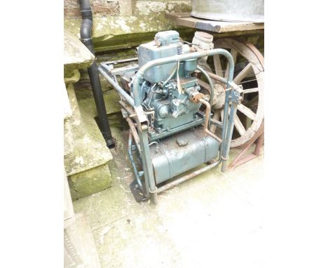 A Rango generator 3.2 kw, 1ph, 50 hz, 110 volts, 3.64 amps, crank operated and petrol driven, the engine cradled in a tubular