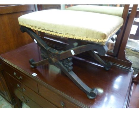 An X-framed oak dressing stool with a rectangular upholstered seat, together with a small rustic stained pine shallow table b