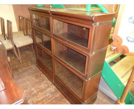 A Globe Wernicke side-by-side bookcase incorporating six glazed up-and-over doors, 138cm wide, of usual modular formation