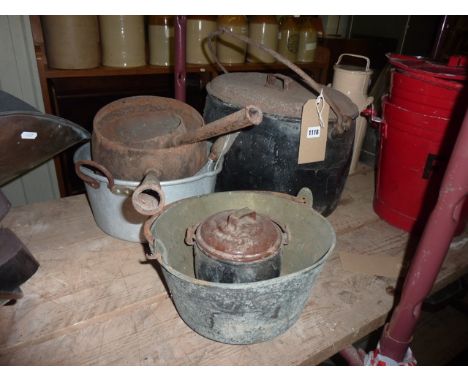 A vintage cast iron and enamel oval tureen and cover with loop handle, together with a brass jam pan, further pans of varying