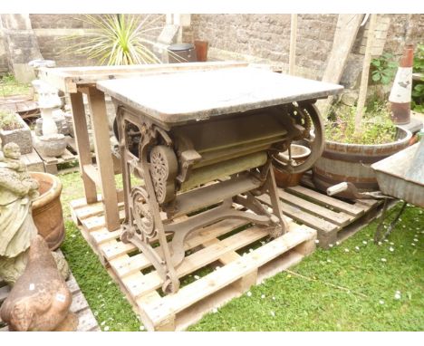A vintage Pioneer trade mark cast iron framed mangle with associated enamel top, together with a small iron framed wheelbarro