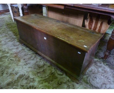 A Georgian oak blanket box with hinged lid, and exposed dove tail construction, with bracket supports
