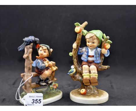 2 GOEBEL HUMMEL FIGURINES - BOY IN APPLE TREE WITH BIRD AND BOY ON FENCE WITH BIRD, SOME REPAIR TO TREE TRUNK A/F 