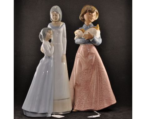 NAO GIRL HOLDING DOG IN ARMS, UNBOXED PLUS ONE OTHER (1)