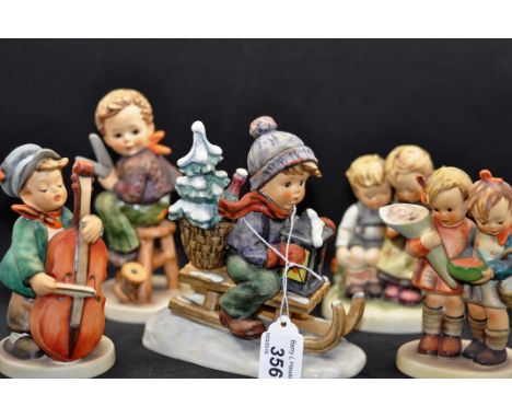 5 WEST GERMANY GOEBEL HUMMEL FIGURINES - BOY PLAYING CELLO, SMALL CHIP TO THE BASE, ' THE SMART LITTLE SISTER', 'RIDE INTO CH