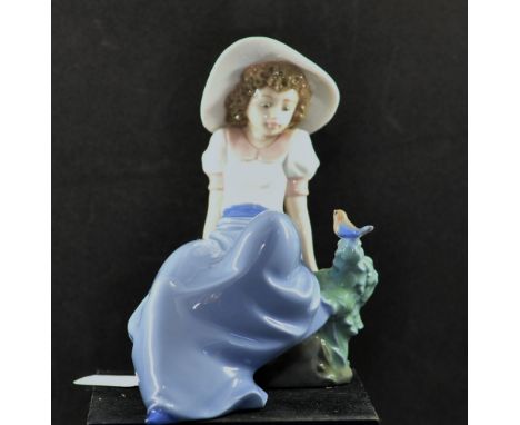 NAO GIRL WITH HAT SITTING ON ROCK WITH BIRD ON BUSH, UNBOXED (1)
