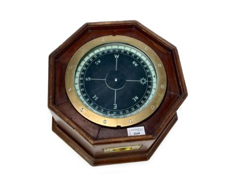 MID-20TH CENTURY SHIP'S COMPASS, contained within an octagonal oak frame with twin swing handles, 34cm wide