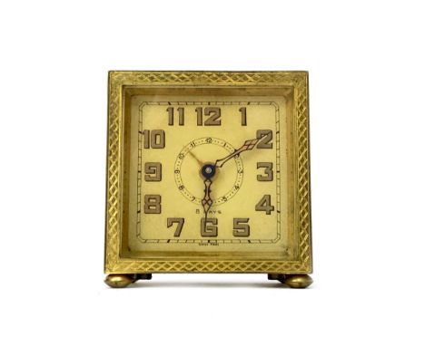 MID 20TH CENTURY TAVELING TIMEPIECE, gilt dial with Arabic numerals, with engine turned gilt case , 6cm high, with fitted tra