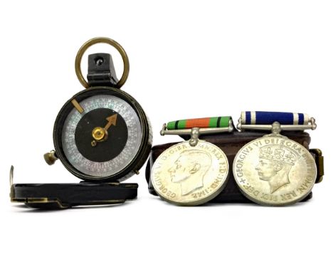 WWI PRISMATIC COMPASS, 5cm diameter, with leather carry case, along with a Police Long Service medal, inscribed Donald H. McK