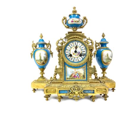 VICTORIAN GILT METAL AND CERAMIC GARNITURE, the two train movement by Japy Freres &amp; Co., the dial with Roman numeral chap