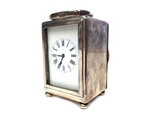 EARLY 20TH CENTURY SILVER CASED MINIATURE CARRIAGE CLOCK, the white enamel dial with a Roman numerals, the case by William Co