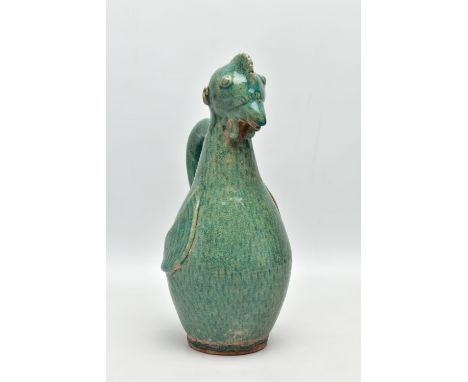 A PRE- COLUMBIAN STYLE GREEN GLAZED POTTERY FLASK IN THE FORM OF A CHICKEN, with a small hole in the top of the head, C shape