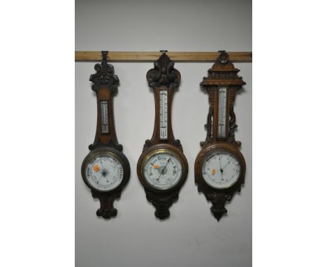 THREE LATE 19TH/EARLY 20TH OAK ANEROID BAROMETERS, two unsigned, one signed Munt of Worcester, largest barometer height 91cm 