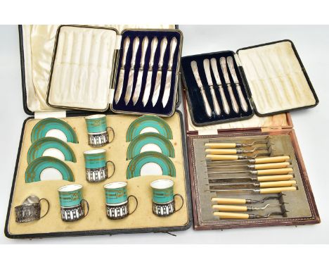 A CASED GEORGE JONES &amp; SONS CRESCENT CHINA TWELVE PIECE COFFEE SET, comprising six silver handled sleeves containing five