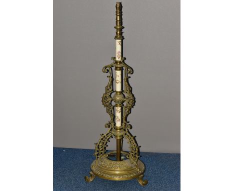 A LATE VICTORIAN BRASS AND CERAMIC TELESCOPIC STANDARD LAMP BASE, INCOMPLETE, the three ceramic sections printed and painted 