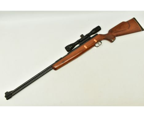 A .22” WEIHRAUCH HW77 SPRING OPERATED AIR RIFLE, serial number 1011086, it is in good working order and is fitted with an ASI