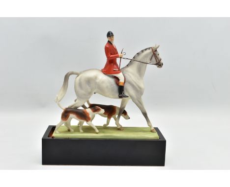 A ROYAL WORCESTER PORCELAIN FIGURE GROUP 'HUNTSMAN AND HOUNDS' MODELLED BY DORIS LINDER, no.3115, date cypher for 1971, heigh