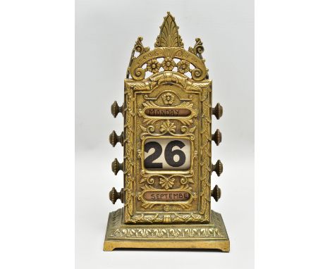 A LATE VICTORIAN BRASS PERPETUAL CALENDAR BY WILLIAM TONKS &amp; SONS, the front plate cast with foliate decoration, four kno