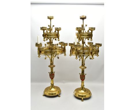 A PAIR OF VICTORIAN ECCLESIASTICAL GOTHIC BRASS TEN LIGHT CANDELABRA IN THE STYLE OF PUGIN, the candleholders spread over thr