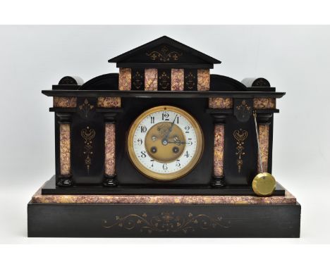 A LATE VICTORIAN BLACK SLATE AND MARBLE INSET MANTEL CLOCK OF ARCHITECTURAL FORM, the case with gilt decoration, the white en