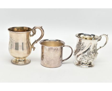TWO VICTORIAN SILVER CHRISTENING MUGS AND AN ELIZABETH II SILVER CHRISTENING MUG, comprising a repousse decorated and wrythen