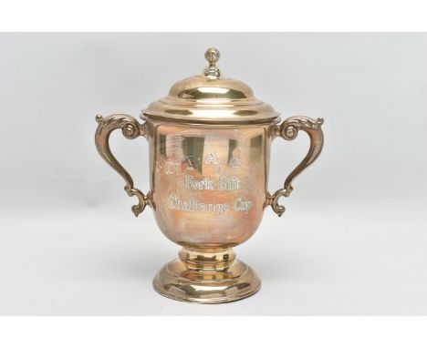 A GEORGE V SILVER TWIN HANDLED TROPHY CUP AND COVER, the pull off domed cover with foliate ball finial, S scroll handles, eng