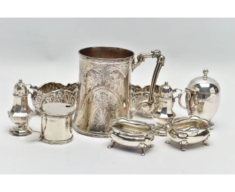 A GROUP OF SILVER, comprising a Victorian silver mug of conical form, cast foliate handle, the body engraved with foliate dec
