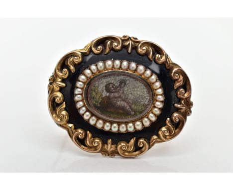 A VICTORIAN YELLOW METAL MICRO MOSAIC MOURNING BROOCH, the central micro mosaic panel depicting a cherub, with a split pearl 