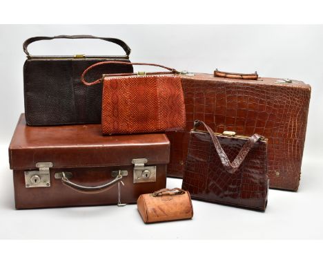 A VINTAGE CROCODILE SKIN SUITCASE BY DREW &amp; SONS OF PICCADILLY CIRCUS, LONDON, the centre of the lid with six glued on pa