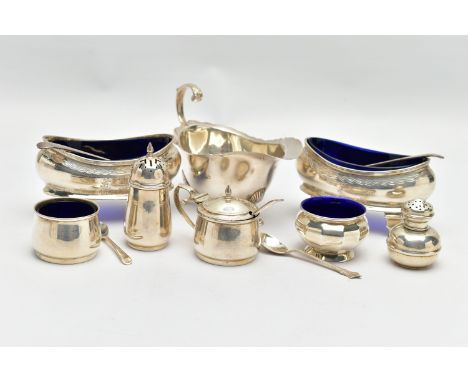 A PAIR OF GEORGE V SILVER NAVETTE SHAPED SALTS, FOUR OTHER SILVER CRUET ITEMS, A GEORGE V SILVER SAUCE BOAT AND FIVE SILVER C