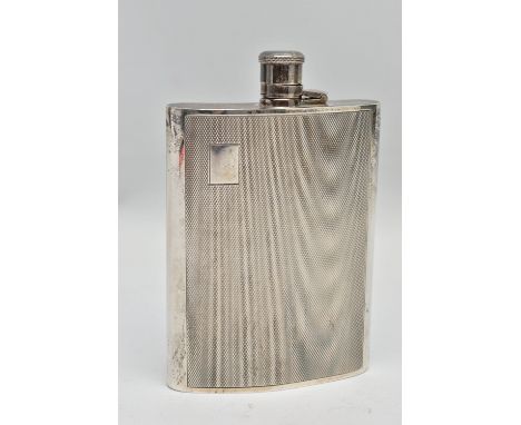 AN ELIZABETH II SILVER HIP FLASK OF BOWED RECTANGULAR FORM, fitted with a hinged bayonet cap with cork inner, engine turned d