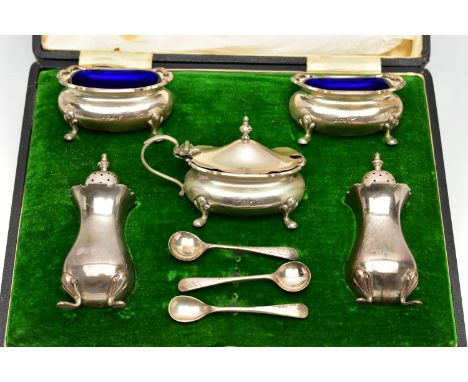 A CASED GEORGE V WALKER &amp; HALL SILVER EIGHT PIECE CRUET SET OF SHAPED RECTANGULAR FORM, wavy rims, four cabriole legs, co