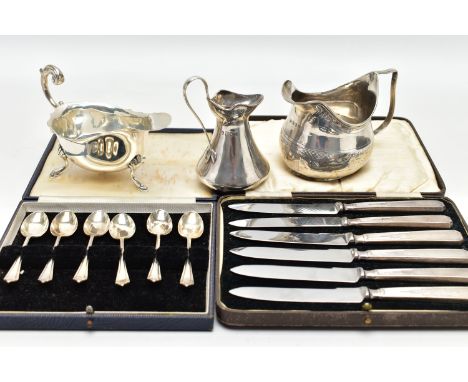 A CASED SET OF ELIZABETH II SILVER TEA SPOONS, A CASED SET OF SIX SILVER HANDLED TEA KNIVES AND THREE SILVER JUGS, the cased 