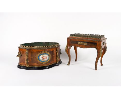 TWO FRENCH GILT-METAL MOUNTED KINGWOOD TABLE JARDINIÈRES (2)Late 19th Century
The first of serpentine form, inset with Sevres