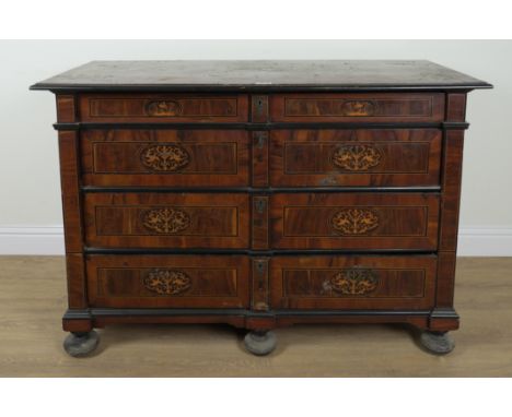 A 19TH CENTURY ITALIAN MARQUETRY INLAID WALNUT FOUR DRAWER COMMODEOn compressed bun feet, 149cm wide; 64cm deep; 101cm high