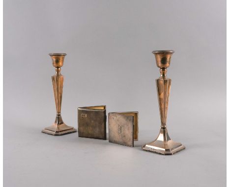 A PAIR OF SILVER CANDLESTICKS, A CIGARETTE CASE AND A LADY'S COMPACT (4)Each candlestick with a tapered stem, raised on a cut