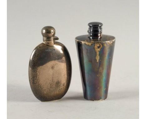 TWO SILVER FLASKS (2)The first of oval form, Sheffield 1908, the second of tapered cylindrical form, Sheffield 1897, both und