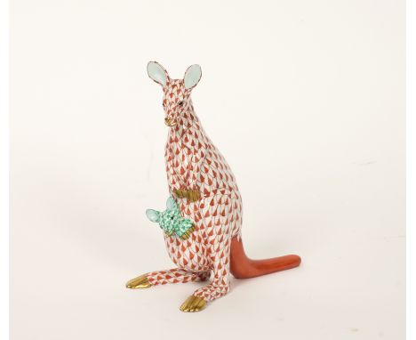 A HEREND PORCELAIN MODEL OF A RUST FISHNET KANGAROO AND GREEN YOUNGBlue factory mark, number 15328/VH, 15cm highGood conditio