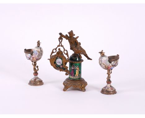 A PAIR OF VIENNESE ENAMEL NAUTILUS SALTS AND A FRENCH GILT AND ENAMEL DECORATED TIME-PIECE (3)Late 19th Century 
Decorated wi