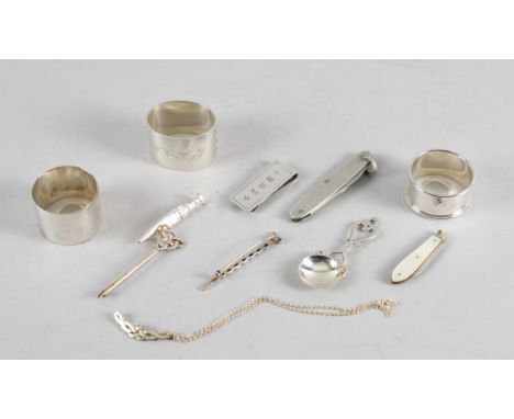 THREE SILVER NAPKIN RINGS AND EIGHT FURTHER ITEMS (11)The further items comprising; a caddy spoon, a money clip, a mother-of-